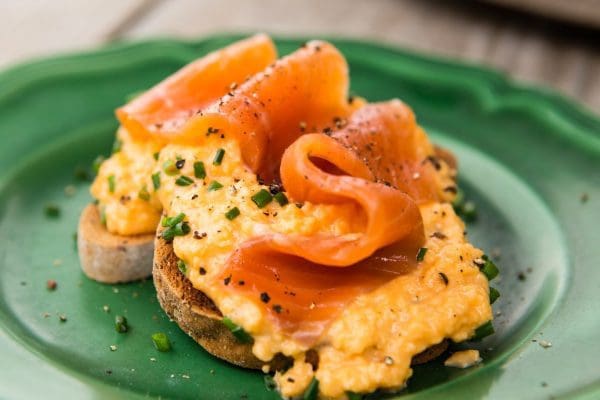 Smoked Trout and Scrambled Eggs at Bibury Trout Farm Plate with smoked trout fillet and creamy scrambled eggs.