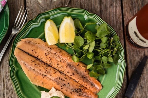 Trout Fillets with Watercress at Bibury Trout Farm Cooked trout fillets served with fresh watercress.