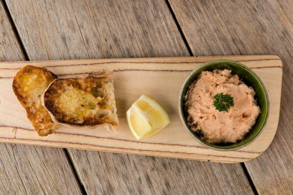 Trout Pâté with Bread at Bibury Trout Farm Bowl of trout pâté served with slices of fresh bread.